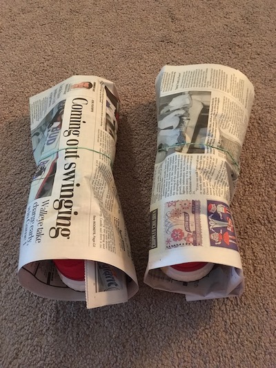 Athletic shoes wrapped with newspaper