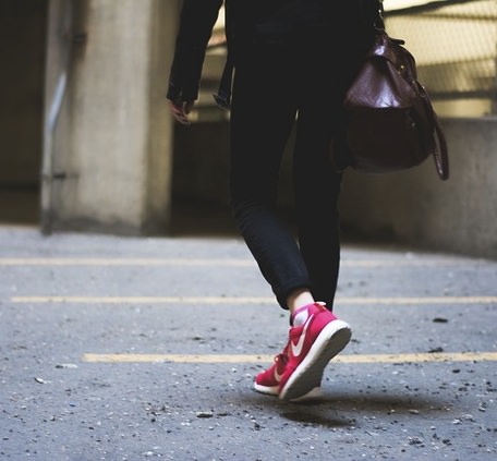 Walking shoes are stiffer than running shoes, with arch support and flatter treads.